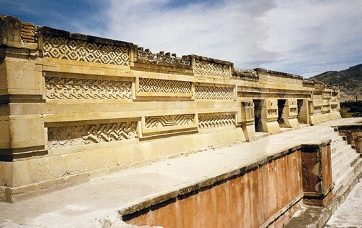 <p>the architecture of the amerindian culture centered in the oaxaca valley of mexico; characterized by great stone masses, the use of interior stone columns, and the highly detailed fretwork of interior and exterior friezes</p>