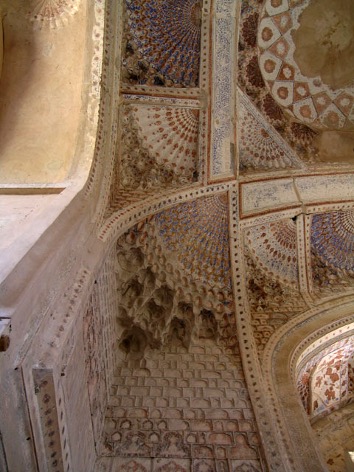 <ul><li><p>Although the façade is very different from Timur’s architecture (three equally spaced blind iwans instead of one large one), the plan is the same cross-in-square, with the same high-profile dome</p><ul><li><p class="MsoListParagraphCxSpMiddle">These high domes serve the same purpose as the tall muqarnas cone found on the Imam Dur Mausoleum (Seljuk) in Samarra – it makes them more visible from afar</p></li><li><p class="MsoListParagraphCxSpMiddle">The ribbed dome had muqarnas corbels at the bottom of each rib</p></li></ul></li><li><p class="MsoListParagraphCxSpMiddle">Gawharshad’s tomb is one of the first great examples of the use of the <strong>squinch-net</strong></p><ul><li><p class="MsoListParagraphCxSpMiddle">The squinch-net is an elaborate system of vaulting using squinches and transverse ribs, with the areas between the ribs as well as the squinches are filled with muqarnas</p></li><li><p class="MsoListParagraphCxSpMiddle">The areas in between the transverse ribs are then filled with a stellar or fan shaped pattern that is supported by muqarnas in the bottom half</p></li><li><p class="MsoListParagraphCxSpMiddle"><u>This will only work with a cross-in square plan</u></p></li></ul></li></ul><p></p>