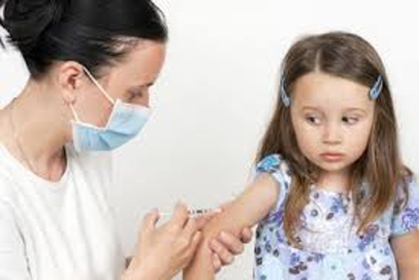 <p>Injecting person with small dose of a virus to help build immunization to a dz.</p>