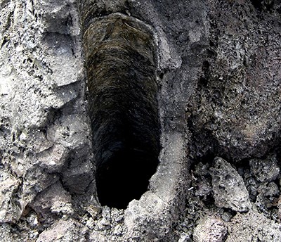 <p>cylindrical hollows left behind in a lava flow if the lava has completely incinerated the tree it once flowed around</p>