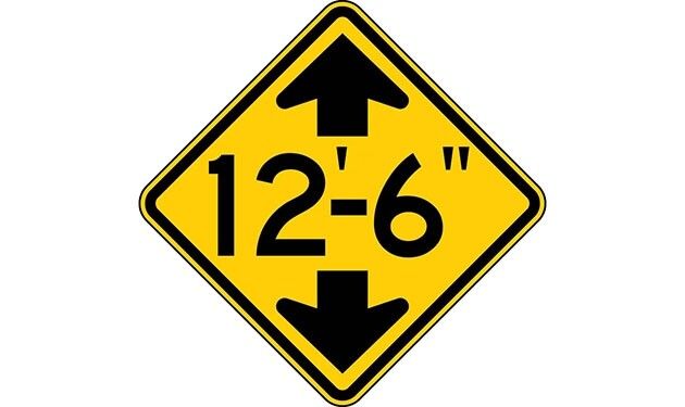 Crossing signs warn drivers to watch for animals, humans, and vehicles crossing the road.