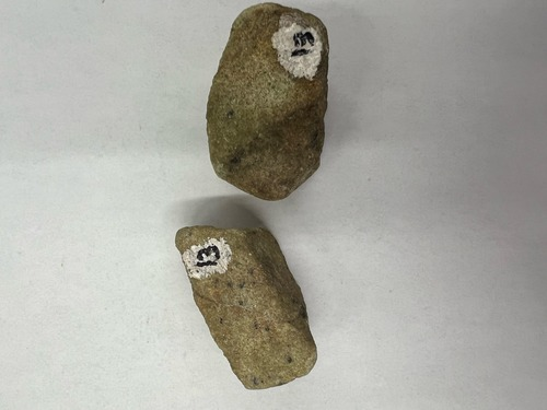 <ul><li><p>Green with small black specks</p></li><li><p>Non-metallic</p></li><li><p>Hardness: 6-6.5</p></li></ul>