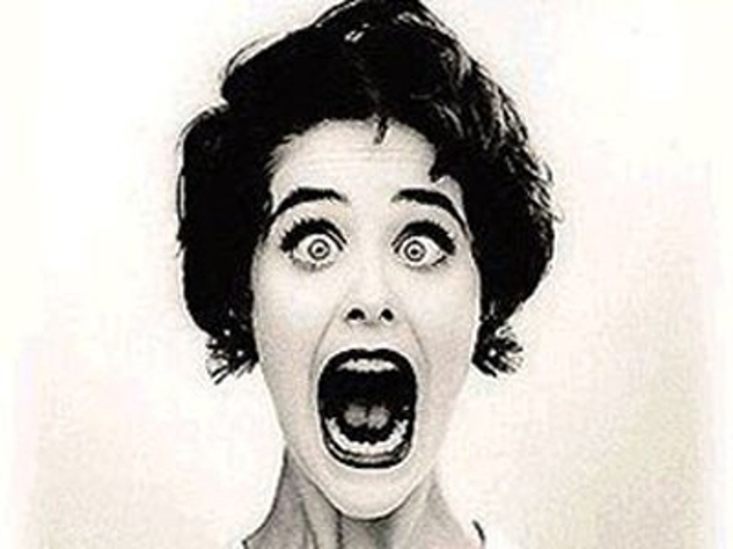 <p>(adj.) full of or loaded with; accompanied by</p>