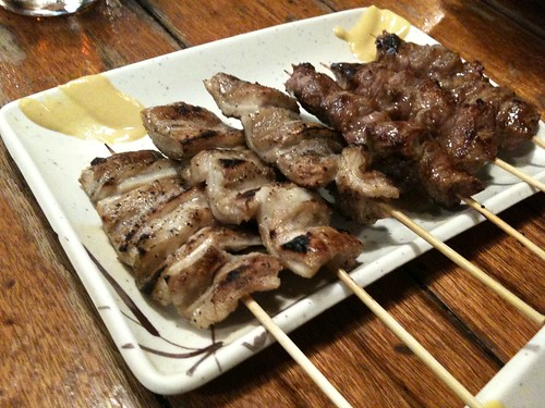 <p>grilled chicken served on a skewer</p>