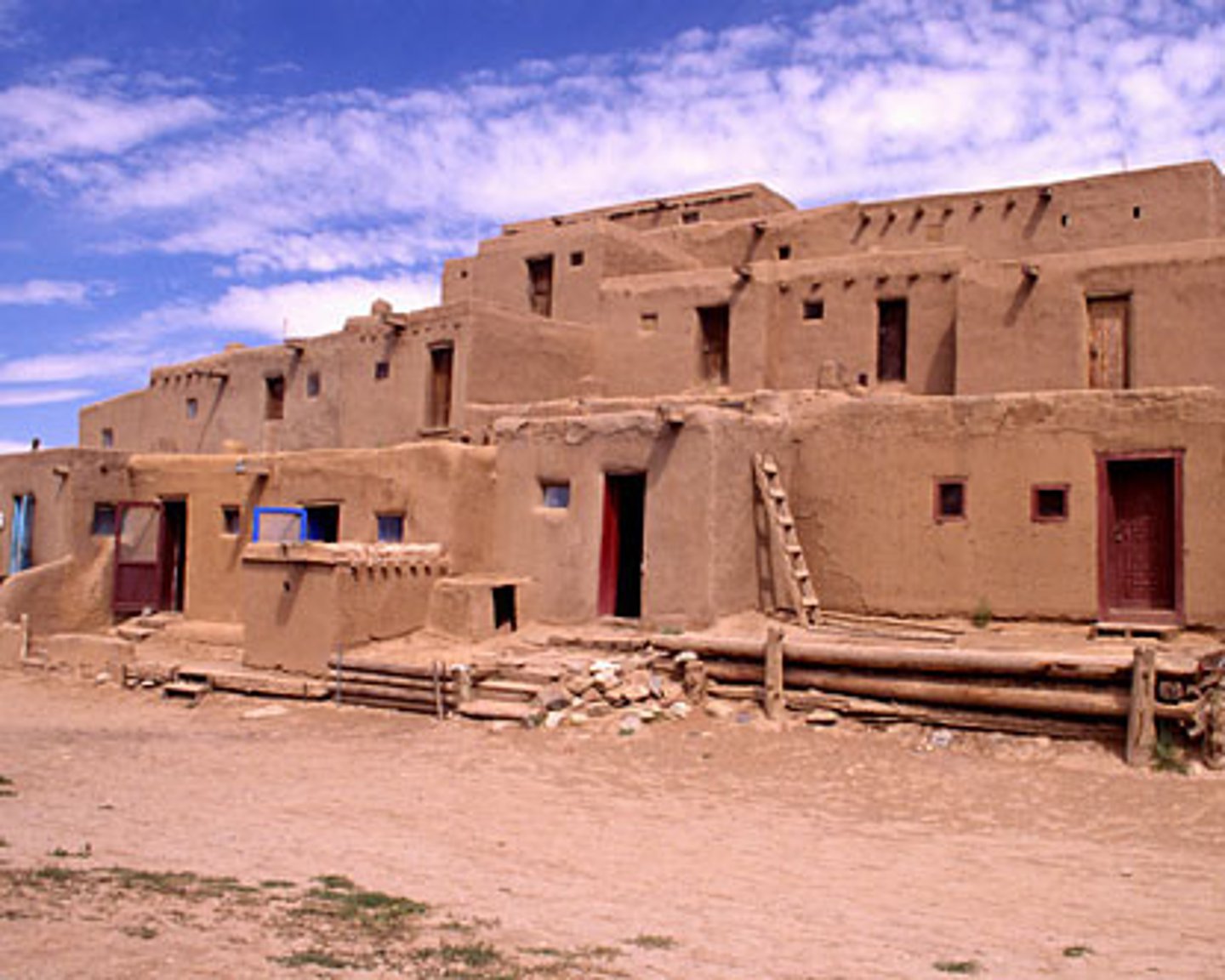 <p>a communal village of flat-roofed structures of many stories that are stacked in terraces; made of stone or adobe</p>