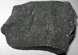 <p>dark gray/black, fine grained aphanitic, 6 on the hardness scale. no real cleavage, and is an extrusive igneous rock. mafic - can tell because of dark heavy density</p>