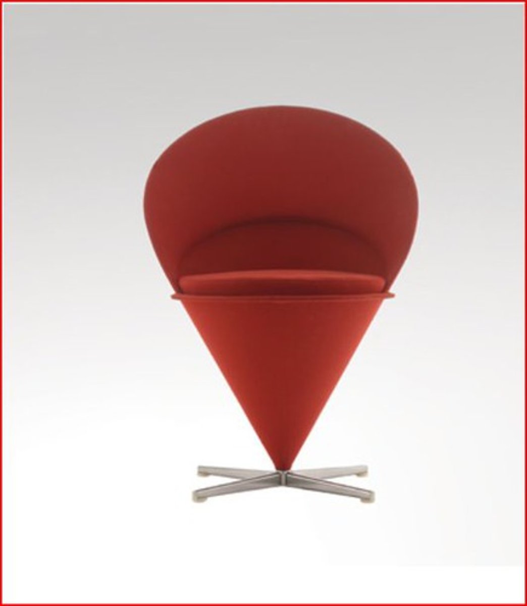 <p>Designed by Verner Panton; The chair consists of a cone-shaped metal frame which rotates at its base on a cross-shaped metal foot.</p>