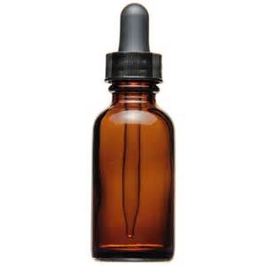 A small square glass bottle which has an eye dropper for a lid