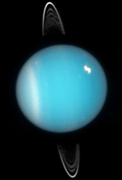 <p>Spins on its side and has an atmosphere containing more water, methane and ammonia than other gas giants.</p>