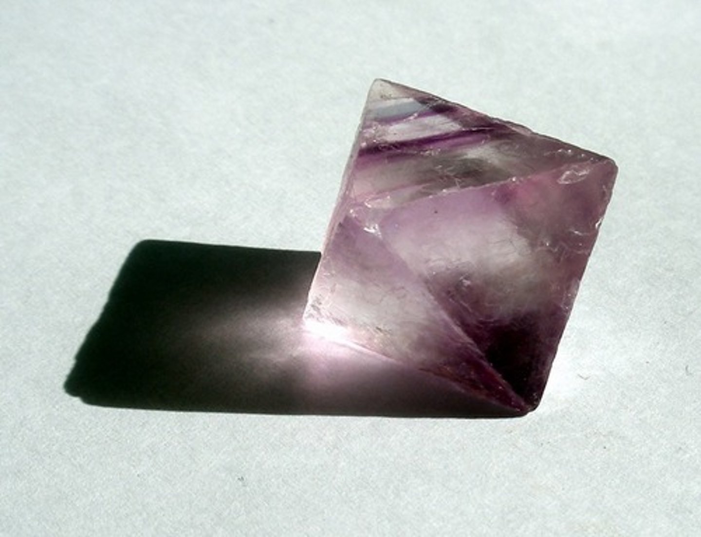 <p>Mineral</p><p>Color: purple, green to yellow or colorless</p><p>Streak: Layers:</p><p>Texture: smooth</p><p>Shiny: glassy or pearly</p><p>Hardness: Moh's scale 4</p><p>Other: makes massive crystals at times</p><p>glows in ultraviolet light</p><p>Used in the manufacturing process of steel</p><p>You can tell purple fluorite from amethyst quartz by the shape of the crystals.</p>