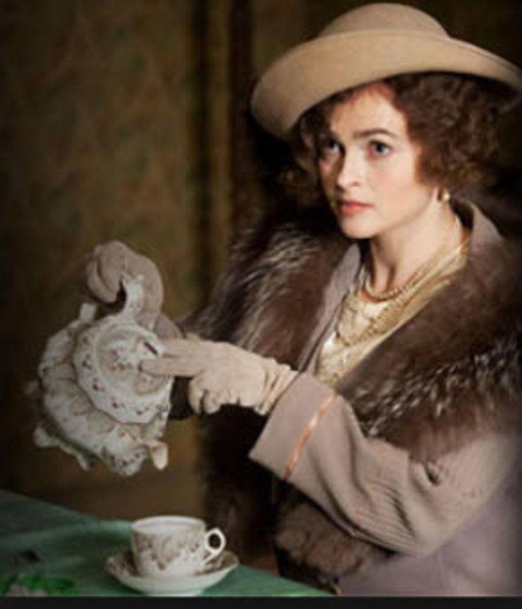 <p>(adv) in a very formal and correct way (disapproving)</p><p>e.g: She sat _____________ on the edge of the chair, hands folded in her lap.</p>