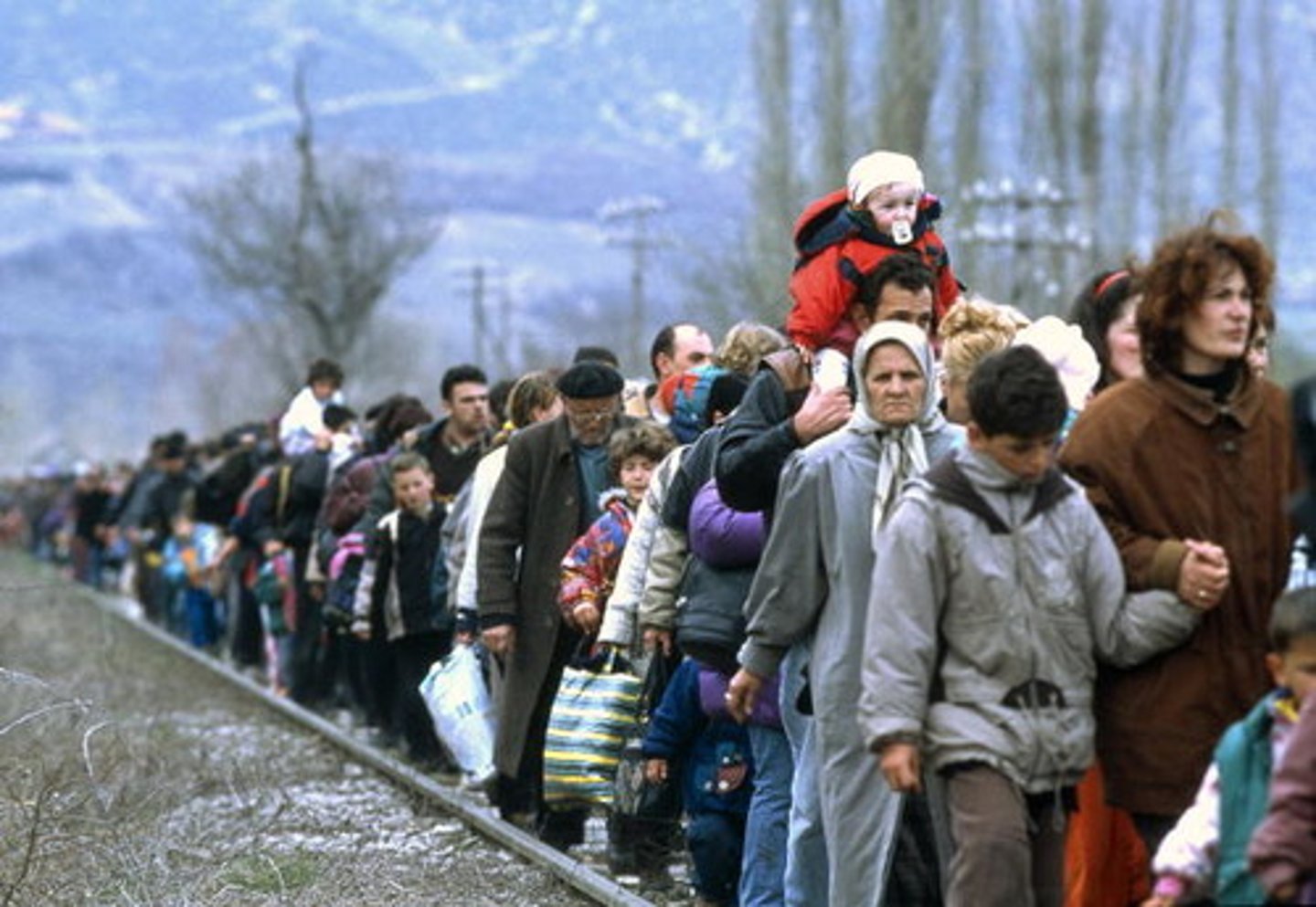 <p>A person who has been forced to leave their country in order to escape war, persecution, or natural disaster.</p>