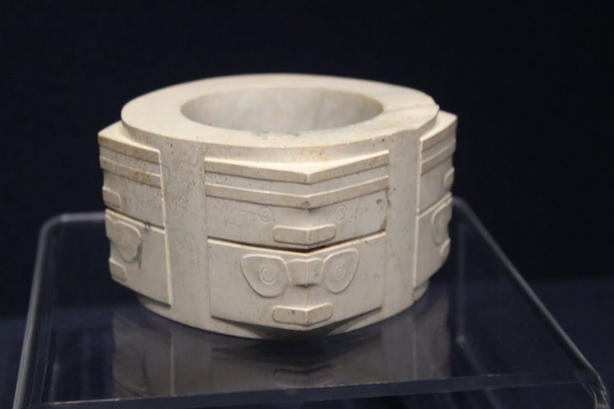 <p>Neolithic jade artifact. Hollow cylinder with circular perforations. Found in ancient Chinese tombs. Symbolic significance in Chinese culture. Believed to represent the universe and the cycle of life</p>