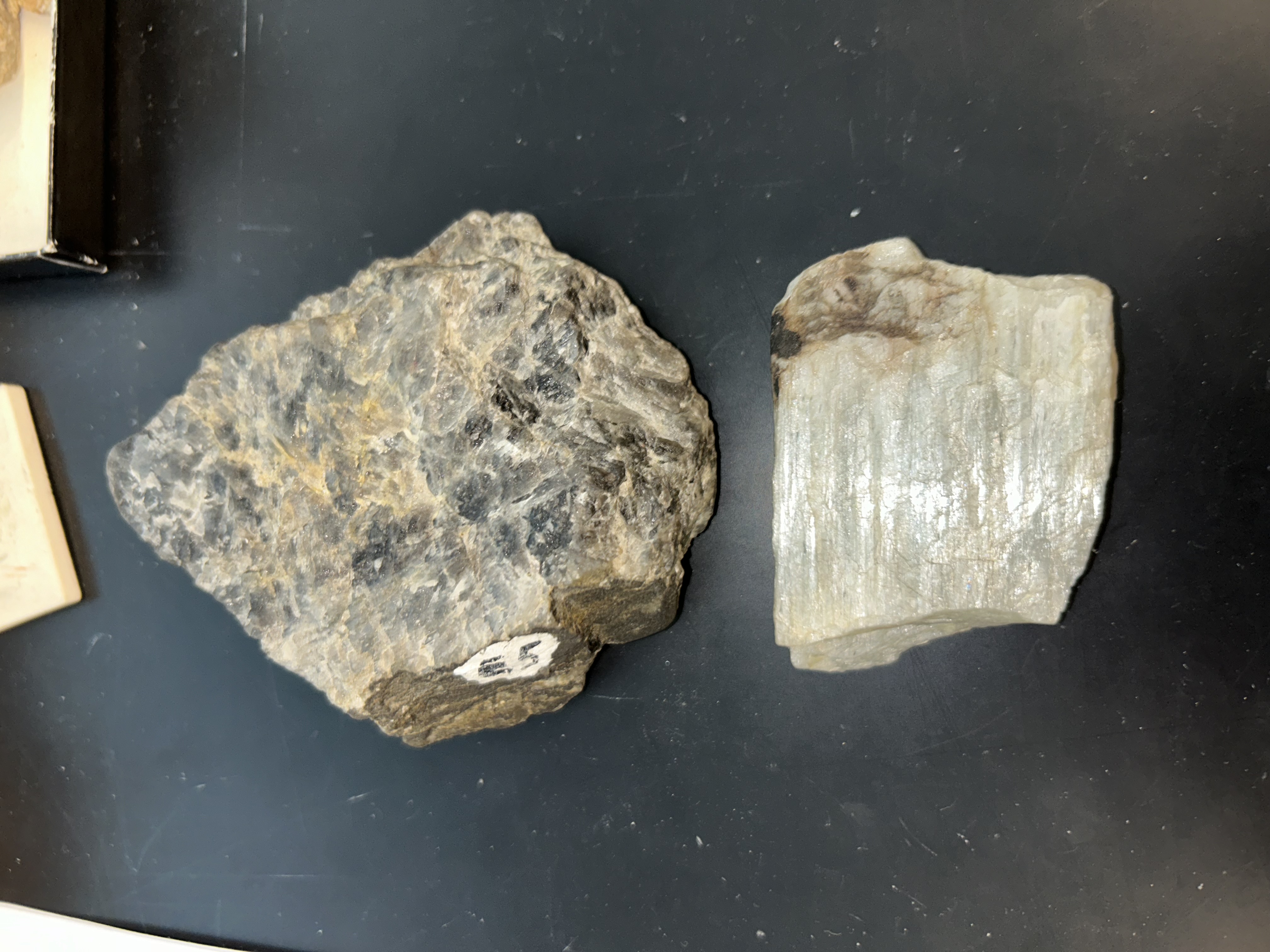 <p>cleavage at 90</p><p>Albite=white </p><p>Anorthite=darker, grey</p><ol><li><p>hardness= 6; scratches glass</p></li><li><p>﻿﻿﻿luster: Vitreous to pearly</p></li><li><p>﻿﻿﻿, gray, blue-gray</p></li><li><p>﻿﻿﻿triclinic</p></li><li><p>﻿﻿﻿twinning, striations</p></li><li><p>﻿﻿﻿tabular crystals</p></li><li><p>﻿﻿﻿this specimen "labradorescence" (play of colors)</p></li></ol>