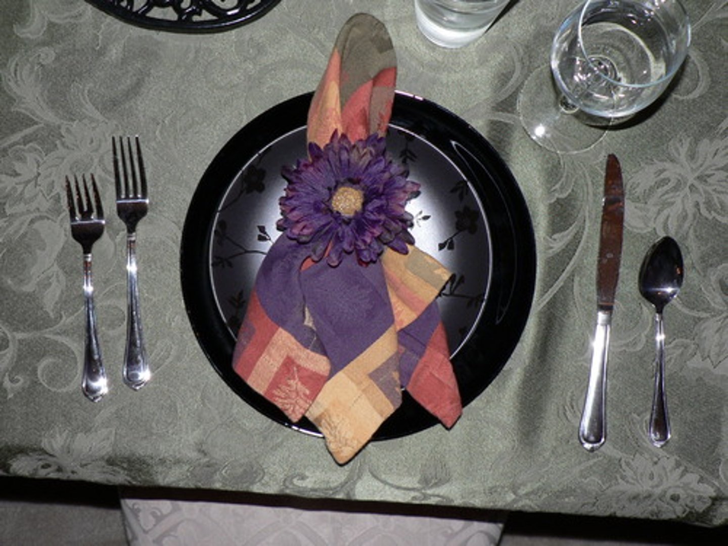 <p>to the left of the fork</p>