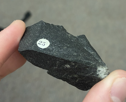 <p>Dark gray, some light gray speckles,<strong> Igneous,</strong> Sides are smooth</p>