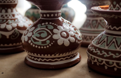 <p>Type of ornamentation: A thick <span style="color: red"><strong>semi-solid fluid</strong></span> composed of clay, water, and other minerals such as quartz, feldspar, and mica, into which the ware is dipped when it is dry enough to be fired.</p>
