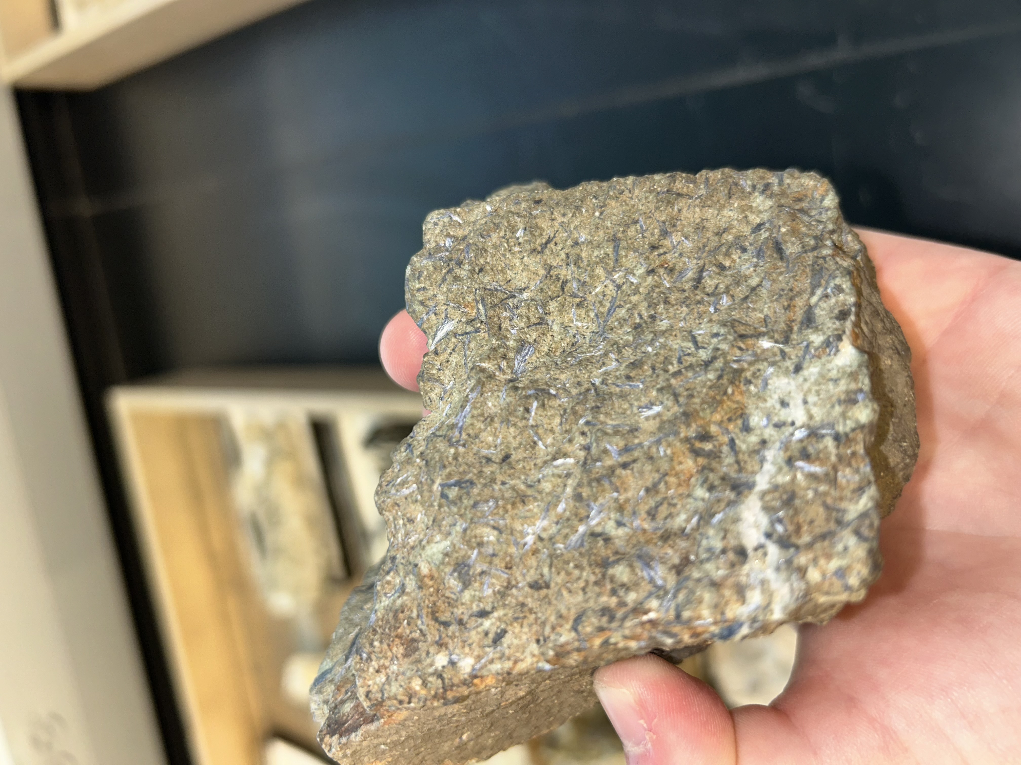 <p>purple/ lavender long needle crystals </p><p>brown/ green matrix</p>