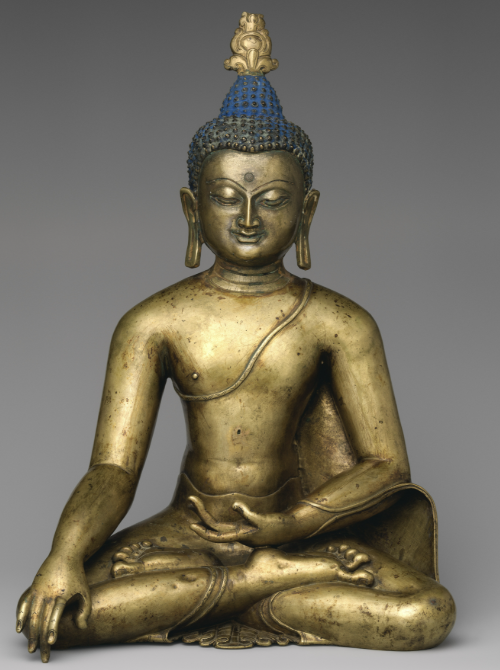 <p>Original Buddha; characterized by elongated ear and meditiation mudra (simple hands overlapping each other)</p>