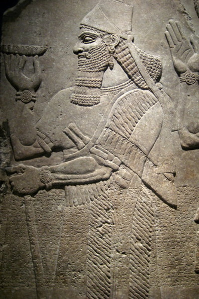 <p>a sculpting technique where the figures/designs are slightly raised from a flat background</p>