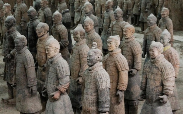 <p>Xi’an, China, 3rd Century BCE, a tomb that has 3 pits full life-sized figures that “guard” the emperor. Shows scale and material (strong terracotta)</p>