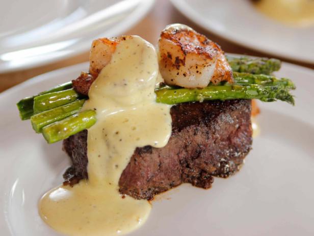 <p>6 oz Filet served over parmesan crusted asparagus, topped with crab meat, lemon butter, red pepper flakes, fried capers, and green onions.</p><p></p>