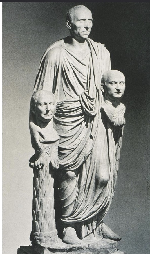 <p>Patrician statue carrying portrait heads</p>