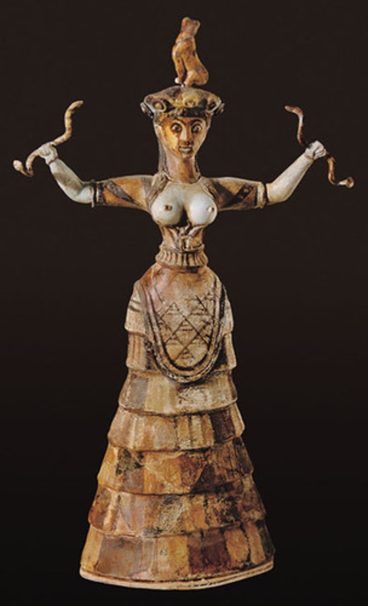<p>Minoan sculpture-earthenware with quartz based glaze over it. This glaze gives a shiny, colorful appearance. She is probably some sort of earth goddess.</p>