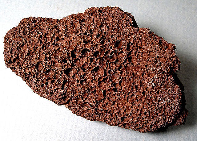 <p>A dark, vesicular (holy) rock that looks "scorched" or burnt.</p>