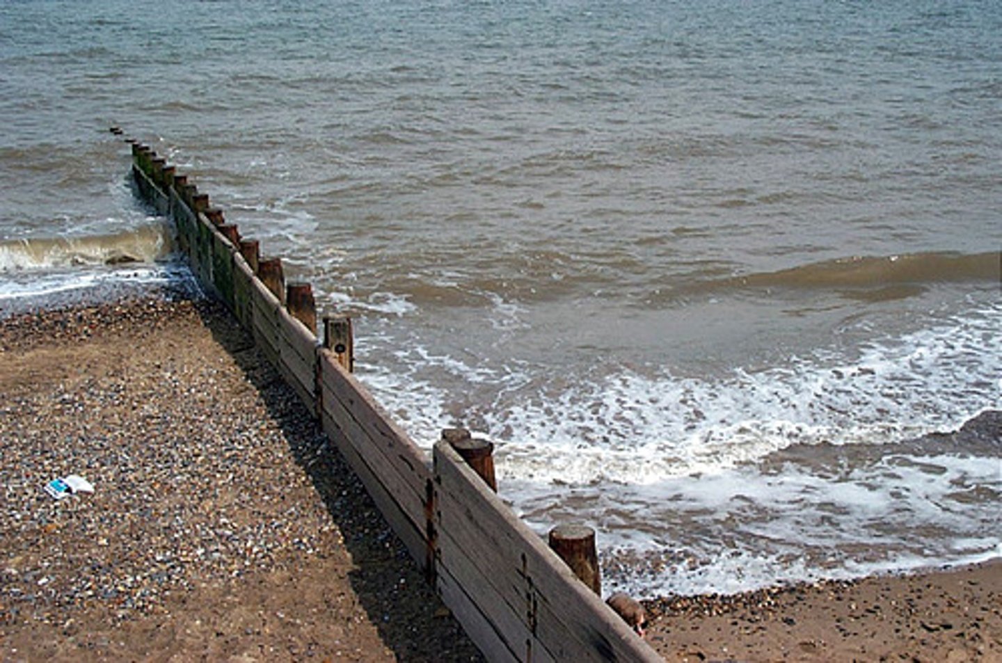 <p>= seaside resort town 10 miles north of Spurn Point<br>... town is surrounded by rich agricultural land and yet sits close to the cliffs and North Sea<br><br>o Lies upon boulder clay deposited by glaciers during the last ice age 18,000 years ago<br>(Boulder clay is very soft and erodes easily)<br><br>o Groynes, concrete seawalls, rock amour<br><br>... defences caused increased erosion south of Withernsea as groynes starve beaches south from deposited material and energy is focused onto cliffs<br>= local sediment budget is affected as sections of cliffs become unstable and collapse</p>