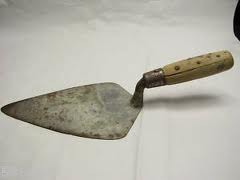 He had a trowel: a mason's tool for building.