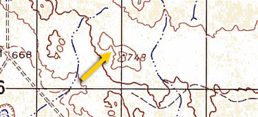 <p>A saddle is a dip or low point between two areas of high ground. Not necessarily the lower ground, just a dip or break. Represented as an hourglass or figure 8 shape in contour lines.</p>