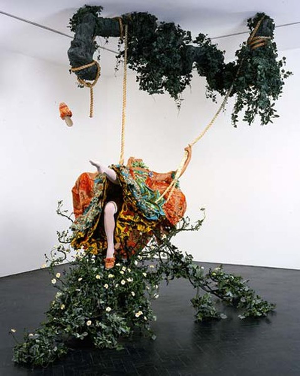 <p>Yinka Shonibare</p><p>2001 CE</p><p>Form: Mixed-Media installation</p><p>Function: Inspired by the Rococo painting by Fragonard.</p><p>Shonibare's version is not the light, airy Rococo dream, but rather a life-sized headless mannequin suspended from the ceiling, she is wearing a dress made from African wax prints, also known as Dutch wax prints. In "The Swing", Shonibare included flowering vines that create a canopy over the swing and fill the floor beneath it. She even loses her shoe, as in Fragonard's original work. She also seems to have lost her head, perhaps a reminder of the beheadings of some French royalty and aristocracy following the frivolous Rococo period.</p>