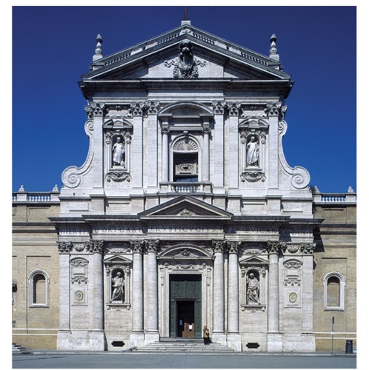 <p>he facade shown contains which of the following architectural elements?</p><p>A</p><p>Flying buttresses and a central spire</p><p>B</p><p>Jamb statues and a recessed portal</p><p>C</p><p>Horseshoe arches and intricate muqarnas</p><p>D</p><p>Engaged columns and decorative pediments</p>