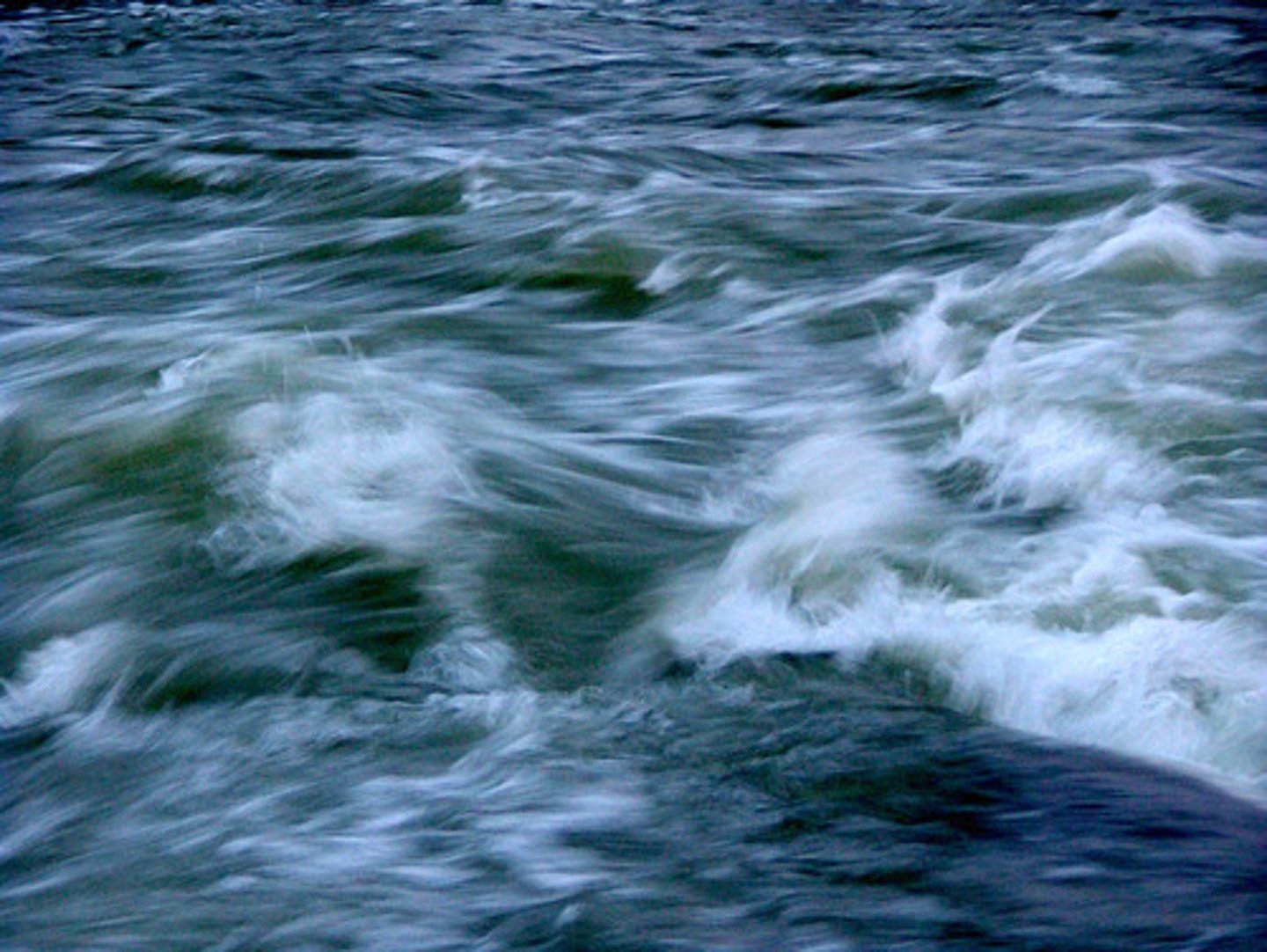 <p>differential erosion occurs due to a mix of hard and soft rock, the river bed therefore becomes unstable and uneven and creates turbulent water forming rapids</p>