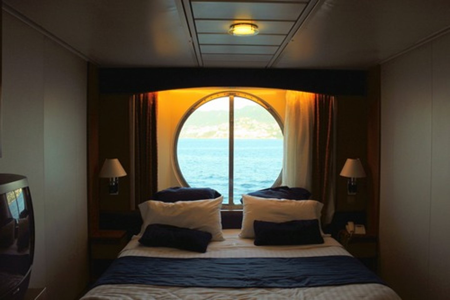 <p>very comfortable and of very high quality c_____</p><p>A two-person passport for the entire weekend is $650, which includes two nights in a d______ c_____ aboard the Queen Mary.</p>