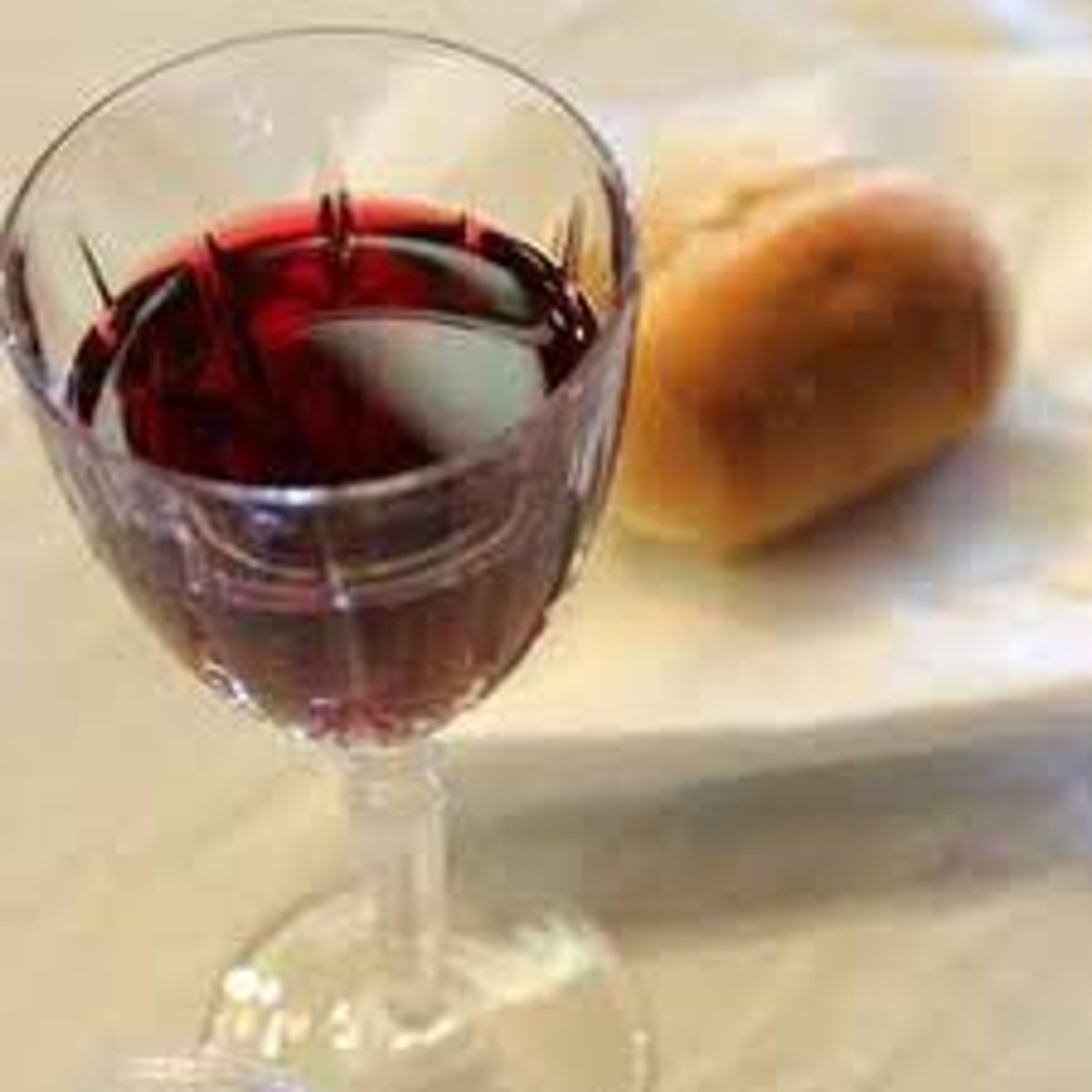 <p>the bread sanctified by the priest at the Christian ceremony commemorating the Last Supper</p>