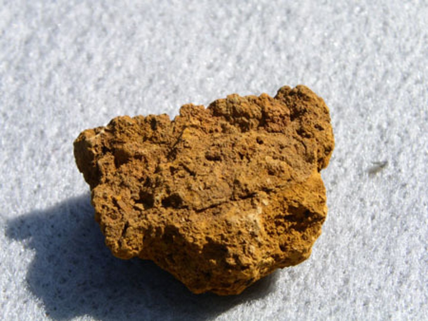 <p>A type of iron oxide that is yellowish-brown when powdered</p>