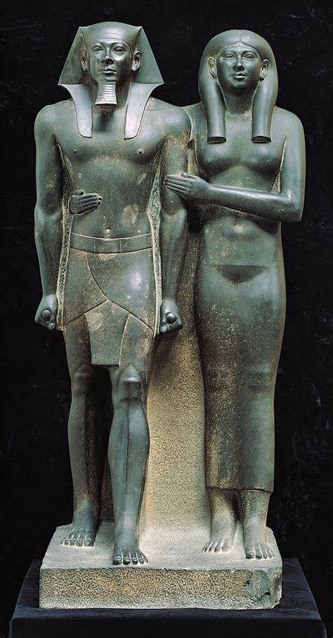 <p><strong>King Menkaure and Queen</strong></p><p>Egyptian Old Kingdom</p><p>Egypt</p><p>2490-2472 BCE</p><p>Greywacke</p>