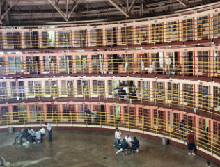 <ul><li><p>system of surveillance</p></li><li><p>structure organically directs inmates to behave thru constant visibility /potential gaze </p></li></ul><p></p>