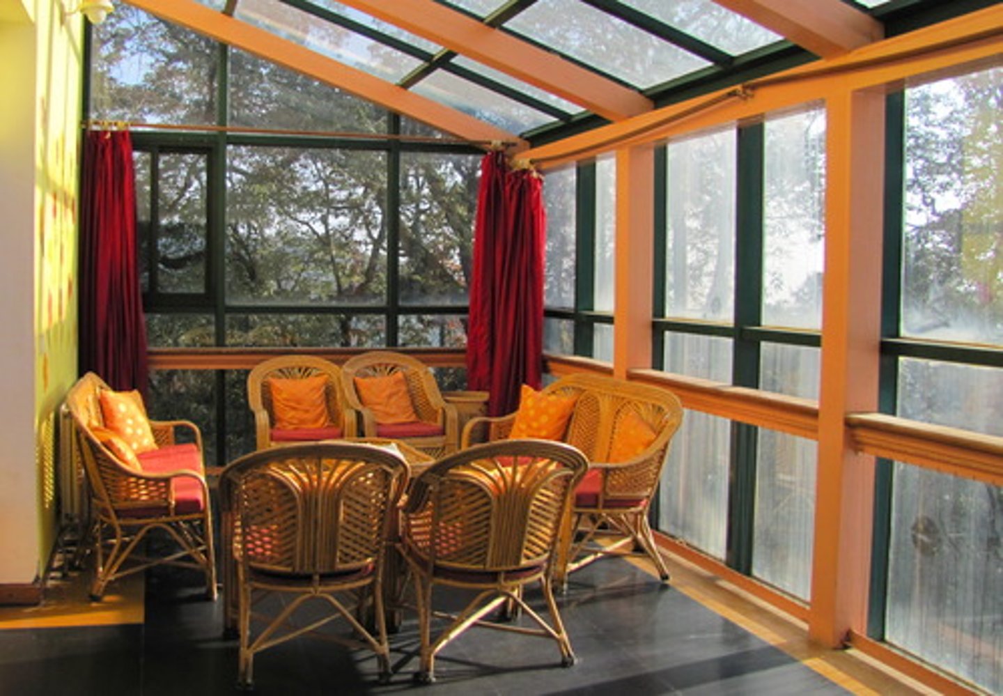 <p>a room or porch surrounded by glass and exposed to the sun</p>