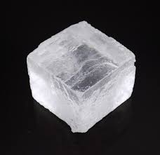 <p>Colorless clear to whiteish, has cubic cleavage, a hardness of 2-2.5, and has a salty taste</p>