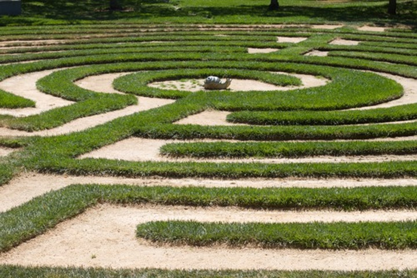 <p>a complicated network of winding passages; a maze</p>