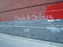 (adj) open, not hidden, expressed or revealed in a way that is easily recognized