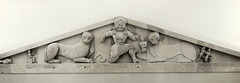 A low triangle at roof ends above the cornice. Often filled with sculptures