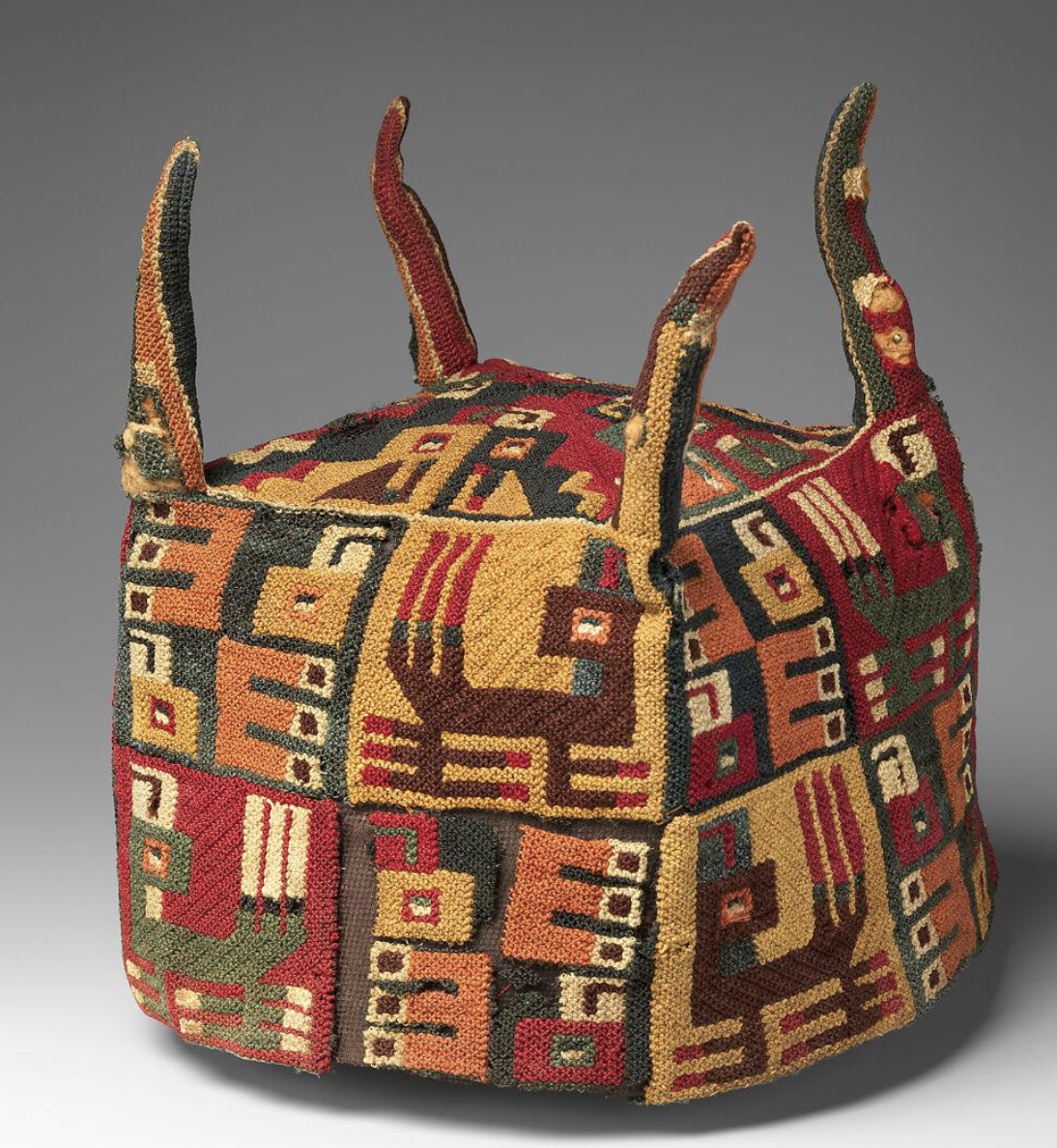 <p><span style="color: rgb(255, 255, 255)">Wari or Tiwanaku, Four-cornered hat</span></p>