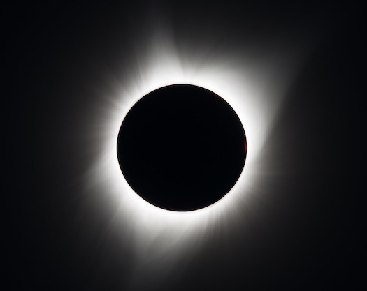 <ul><li><p>Occurs when Moon casts a shadow on Earth, blocking sunlight from reaching that area.</p></li><li><p>Observers in the complete shadow experience a total eclipse, where the Moon fully covers the Sun, revealing the Sun's corona.</p></li><li><p>Temperatures can drop due to the Moon blocking most of the Sun's energy.</p></li><li><p>Only happens during a new moon, but not every new moon because of the Moon's tilted orbit.</p></li></ul>