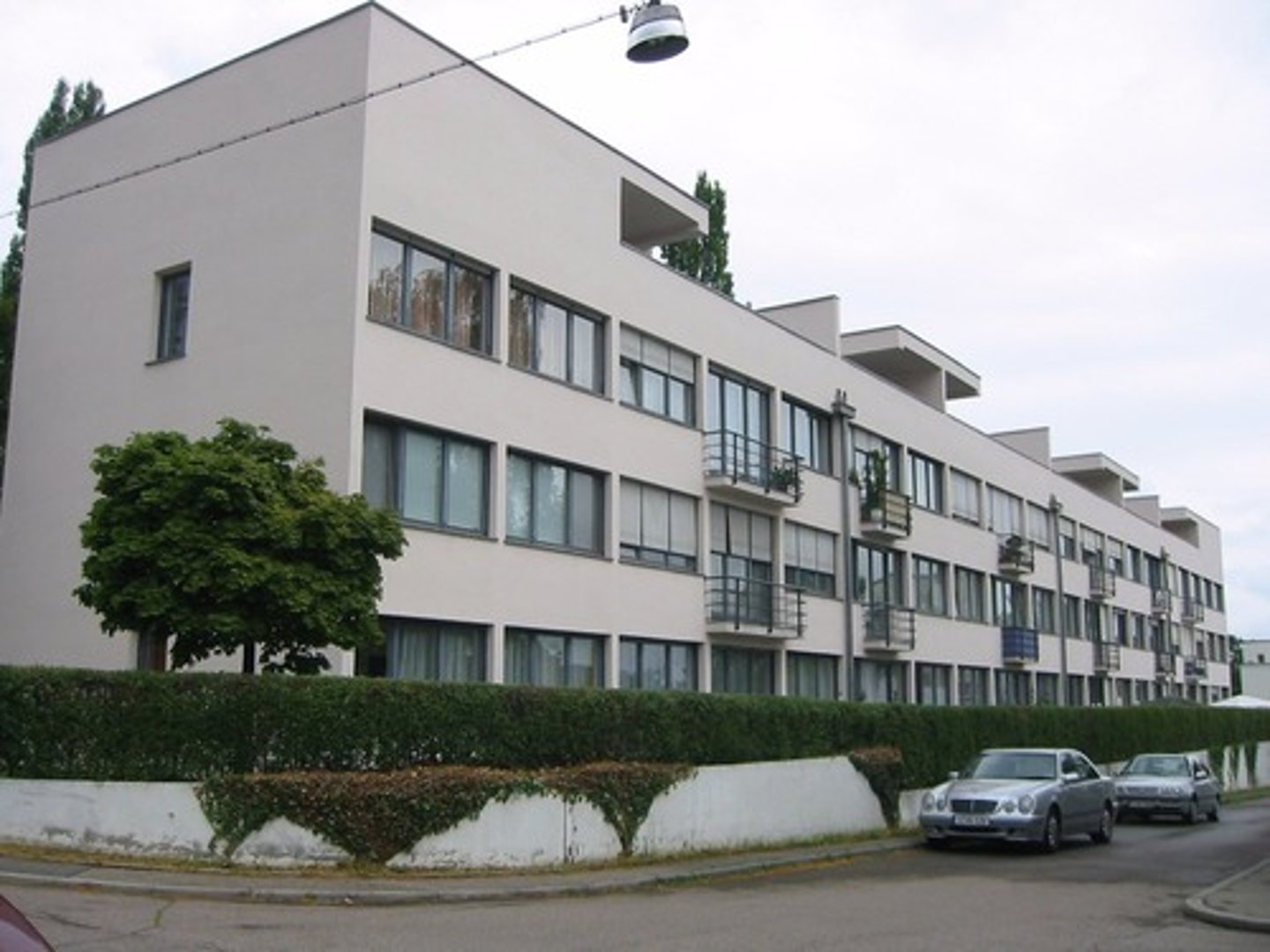 <p>a large building made up of smaller units of apartments</p>
