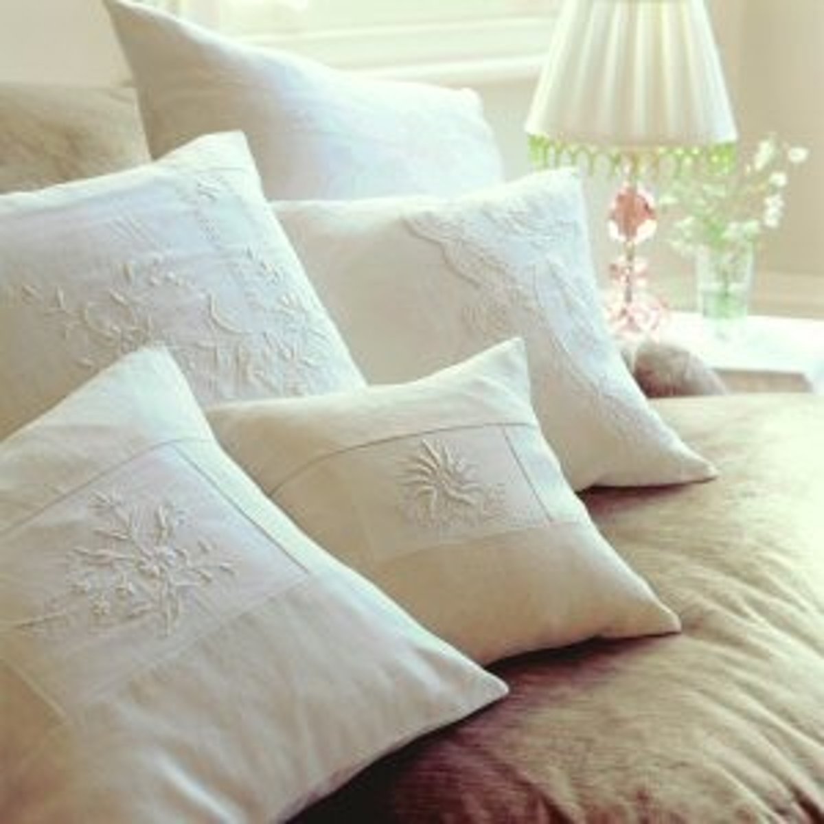 <p>A pillow or a pad with a soft filling.</p>