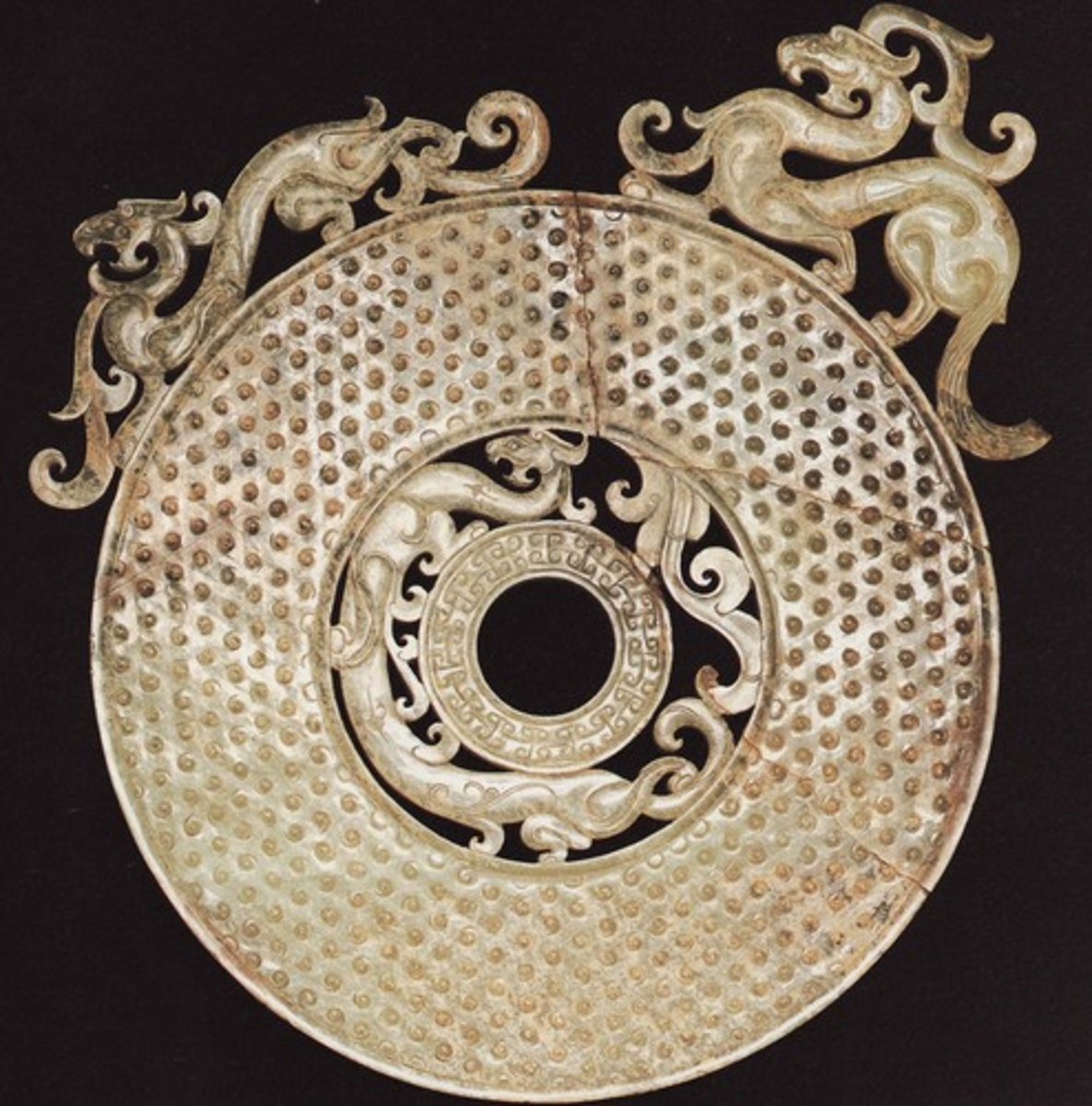 <p>a round ceremonial disk found in ancient Chinese tombs; characterized by having a circular hole in the center, which may have symbolized heaven</p>